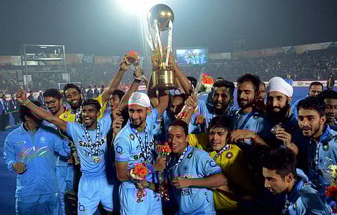 Indian Junior hockey players celebrate with the winning trophy of the Junior World Cup Hockey 2016 after their victory over Belgium in Lucknow. | PTI