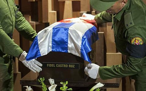 The small coffin containing the ashes of the late Cuban leader Fidel Castro is placed by honor guards at the Ernesto 'Che' Guevara mausoleum in Santa Clara, Cuba.(Photo |AP)
