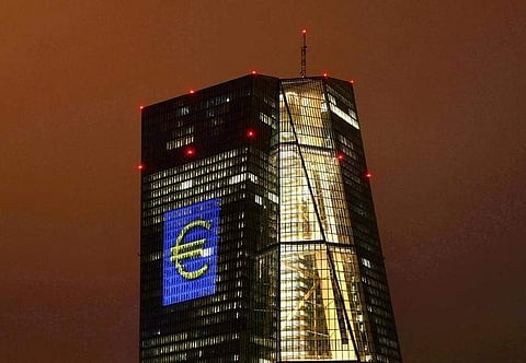 The headquarters of the European Central Bank (ECB) are illuminated with a giant euro sign in Frankfurt in March 2016.