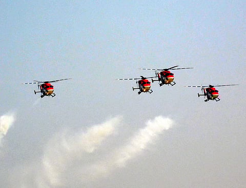 ‘Air Show’ in Bhubaneswar on December 23 to commemorate the birth centenary of legendry leader late Biju Patnaik.Here seen are Sarang acrobat helicopters during the  Air show  at Cuttack on Friday. Express Photo