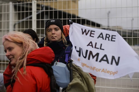 Demonstrators wait for the launch of the Civil March for Aleppo at the air field of the former airport Tempelhof in Berlin. (Photo | AP)