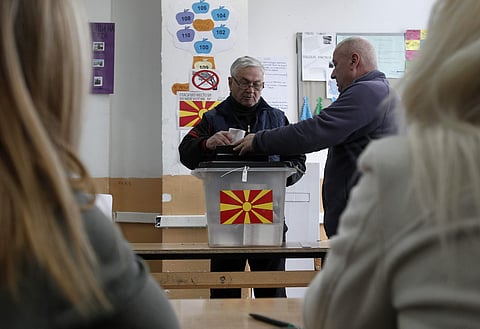 A man casts his ballot at a polling station in village of Tearce, in northwestern Macedonia, on Sunday, Dec. 25, 2016. | AP