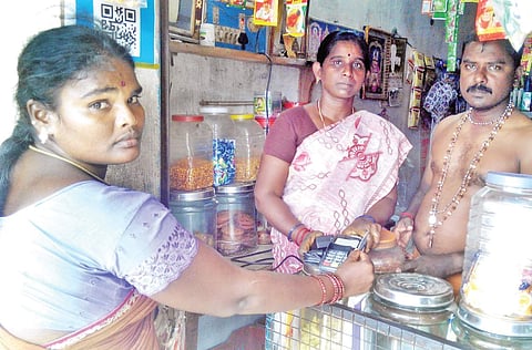 With a view to promoting cashless transactions, the SBI disbursed loans worth Rs 86 lakh to the villagers. | EPS