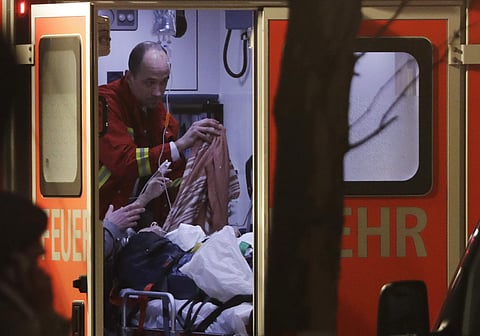 A firefighter attends an injured person after a truck ran into a crowded Christmas market in Berlin, Germany. (Photo | AP)