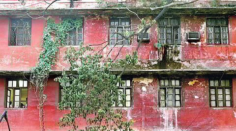 The dilapidated condition of the V-shaped college building.