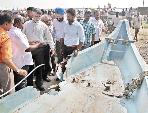 Members of the Central team assessing the cyclone’s havoc at Kasimedu fishing harbour on Thursday. | (Ashwin Prasath | EPS)