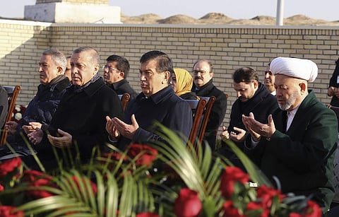 Turkey's President Recep Tayyip Erdogan, second left, and Uzbek President Shavkat Mirziyoyev, center, pray at the tomb of late Uzbek president Islam Karimov in Samarkand. | AP