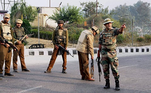 Security personnel take positions during a gun battle with suspected militants at the Army camp in Nagrota in Jammu. (File | PTI)