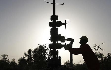 A technician opens a pressure gas valve inside the Oil and Natural Gas Corp (ONGC) group gathering station on the outskirts of Ahmedabad in March 2012.  (File Photo | Reuters)
