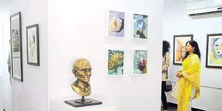 Artist CSN Patnaik, along with his family members, visiting the painting and sculpture exhibition organised by local artists to mark his 92nd birthday celebrations in Visakhapatnam on Tuesday | RVK Ra