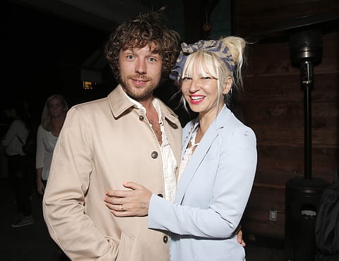 The filmmaker Erik Anders Lang, left, and singer Sia attend a party. (Photo | AP)