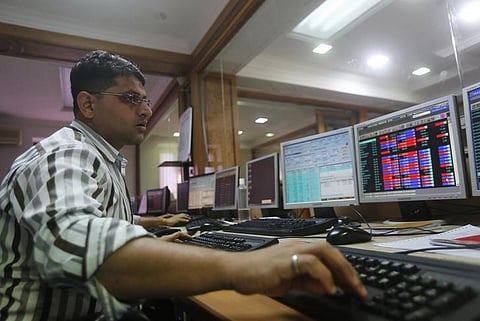 A broker trades on his computer terminal at a stock brokerage firm in Mumbai, India, January 20, 2016. REUTERS/Shailesh Andrad