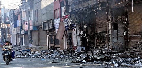 Charred remains of shops set on fire by Jat agitators demanding reservation in Rohtak on Sunday. | PTI