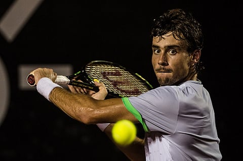 Guido Pella of Argentina plays against Pablo Cuevas of Uruguay during men's singles final match at the 2016 Rio Open tennis tournament in Rio de Janeiro, Brazil, on February 21, 2016. Uruguay's Pablo Cuevas, coming off an upset of Rafael Nadal, won his 