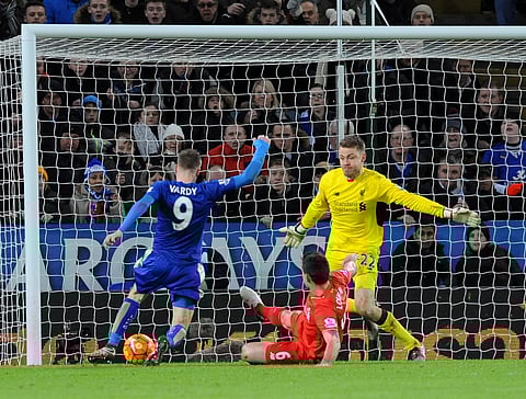 Leicester’s Jamie Vardy, left, scores against Liverpool during the English Premier League soccer match between Leicester City and Liverpool at the King Power Stadium in Leicester, England, Tuesday, Feb. 2, 2016. | AP