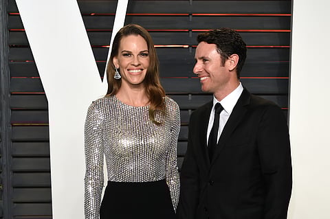 Hilary Swank, left, and Ruben Torres arrive at the Vanity Fair Oscar Party on Sunday, Feb. 28, 2016, in Beverly Hills, California. | AP Photo