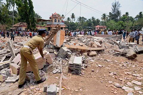 A view of a collapsed building after a massive fire broke out during a fireworks display in Paravoor north of Thiruvananthapuram in Kerala on Sunday. Dozens were killed and many more were injured when a spark from an unauthorized fireworks show ignited a 