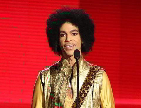 FILE - In this Nov. 22, 2015 file photo, Prince presents the award for favorite album - soul/R&B at the American Music Awards in Los Angeles. Saturday Night Live alum Jimmy Fallon hosted SNL's episode Saturday, April 23, which featured clips of Prince pe