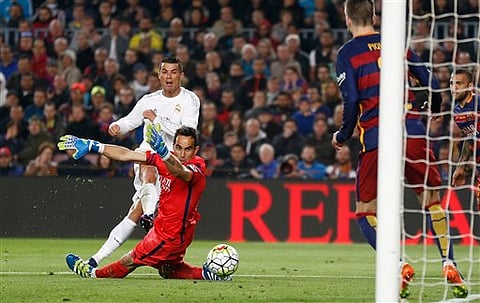 Real Madrid's Cristiano Ronaldo, left, scores his side’s second goal past Barcelona goalkeeper Claudio Bravo during a Spanish La Liga soccer match between Barcelona and Real Madrid, dubbed 'el clasico', at the Camp Nou stadium in Barcelona, Spain. | AP
