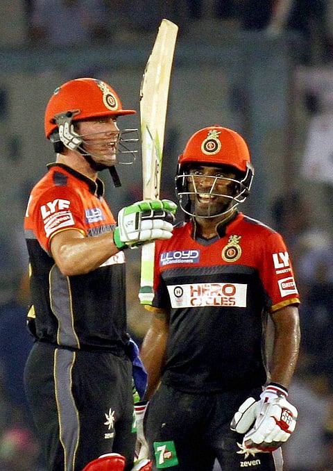 AB De Villiers of Royal Challengers Banglore celebrates his half century during an IPL match against Kings XI Punjab in Mohali on Monday. | PTI