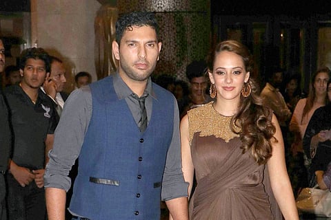 Cricketer Yuvraj Singh with fiance Hazel Keech at the wedding reception of Preity Zinta and Gene Goodenough in Mumbai on Friday evening. | PTI