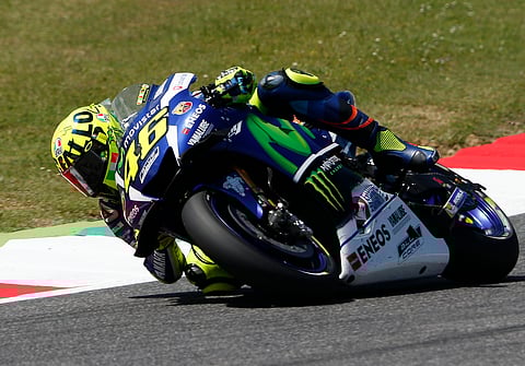 Italy's Valentino Rossi steers his Yamaha on his way to setting the pole position during the qualifying session for Sunday's Italy Moto GP race, at the Mugello circuit, in Scarperia, Italy, Saturday, May 21, 2016. | AP