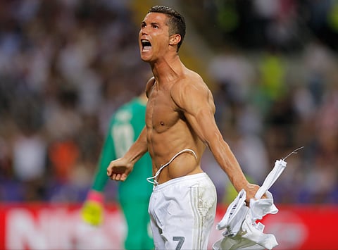 Real Madrid's Cristiano Ronaldo celebrates after scoring the winning penalty shootout during the Champions League final soccer match between Real Madrid and Atletico Madrid at the San Siro stadium in Milan, Italy, Saturday, May 28, 2016. | AP