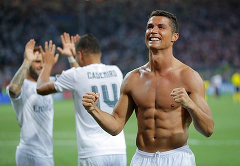 Real Madrid's Cristiano Ronaldo celebrates after scoring the winning penalty shot during the Champions League final soccer match between Real Madrid and Atletico Madrid at the San Siro stadium in Milan, Italy, Saturday, May 28, 2016. Real Madrid won 5-4 