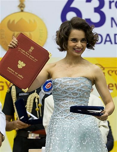 Bollywood actress Kangana Ranaut, poses after receiving the Best Actress award from Indian President Pranab Mukherjee during the national film awards presentation ceremony in New Delhi, India. (AP Photo)