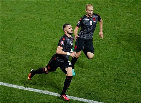 Albania's Armando Sadiku, left, celebrates scoring the opening goal during the Euro 2016 Group A soccer match between Romania and Albania (Photo | AP)