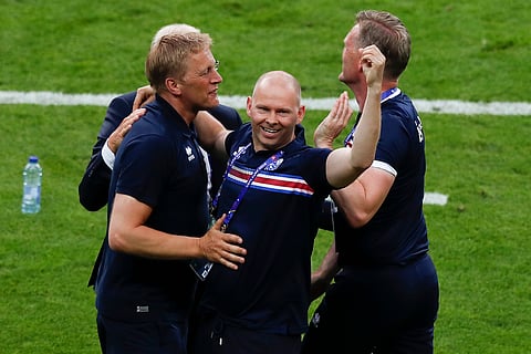 Iceland coach Heimir Hallgrimsson, left, celebrates with team staff at the end of the Euro 2016 Group F soccer match between Iceland and Austria at the Stade de France in Saint-Denis, north of Paris, France, Wednesday, June 22, 2016. Iceland won 2-1. | AP