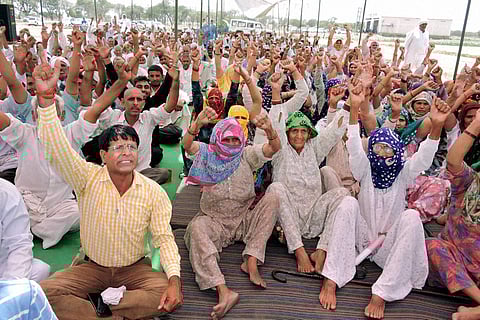 Rohtak Jat community members during their agitation for reservation in Rohtak on Tuesday. | PTI