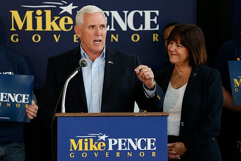 In this May 11, 2016 file photo, Indiana Gov. Mike Pence, alongs with his wife Karen, right, launches his campaign for re-election during an event in Indianapolis. | AP