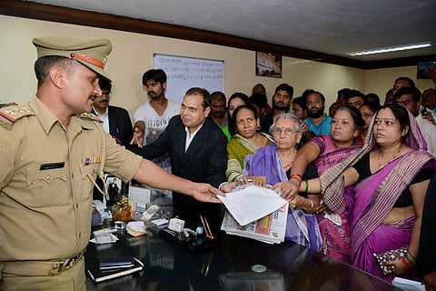 Expelled BJP leader Daya Shankar Singh's mother (C) and other family members files a complaint against Mayawati and other BSP leaders at a police station, in Lucknow on Friday. | PTI