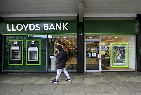 A man walks past a Lloyds Bank branch in London, Britain in this February 25, 2016 file photo. REUTERS