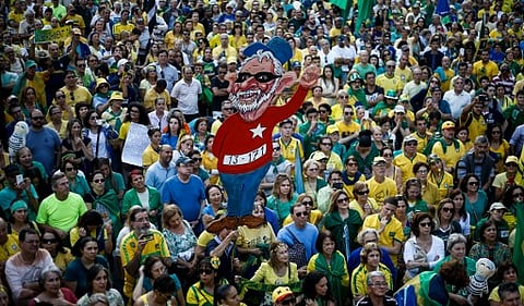 Activists protest against suspended president Dilma Rousseff in Sao Paulo, Brazil on July 31, 2016. | AFP