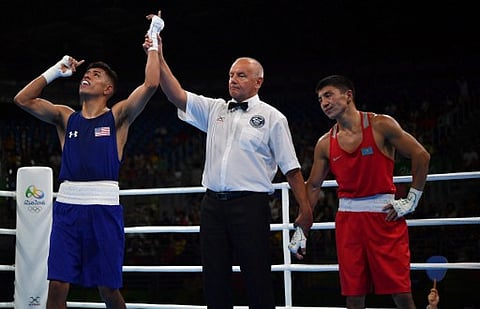USA's Carlos Zenon Balderas Jr. (L) celebrates winning against Kazakhstan's Berik Abdrakhmanov during the Men's Light (60kg) match at the Rio 2016 Olympic Games at the Riocentro - Pavilion 6 in Rio de Janeiro on August 6, 2016.  | AFP