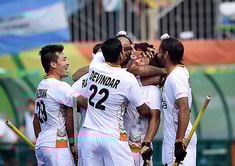 India's Kothajit celebrating with team members after scoring a goal against Argentina during the Qualifying round match at the Summer Olympic 2016 at Rio de Janeiro Brazil on Tuesday. | PTI