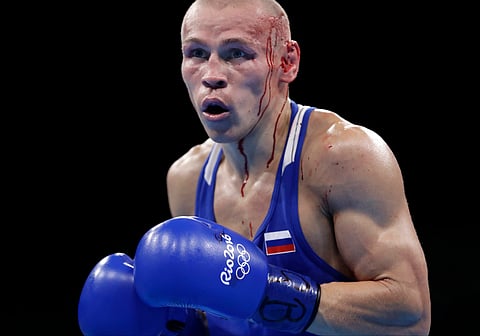 Russia's Nikitin Vladimir bleeds from cuts in his head as he fights Vanuatu's Boe Warawara during a men's bantamweight 56-kg preliminary boxing match at the 2016 Summer Olympics in Rio de Janeiro, Brazil, Wednesday, Aug. 10, 2016. | AP