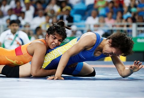 India's Sakshi Malik (red) wrestles with Kirghyzstan's Aisuluu Tynybekova in their women's 58kg freestyle bronze medal match during the wrestling event of the Rio 2016 Olympic Games at the Carioca Arena 2 in Rio de Janeiro. (File|AFP)