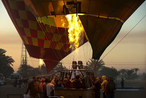 A hot air balloon prepares to take off on the west bank of the Nile River in Luxor, Egypt. (AP)