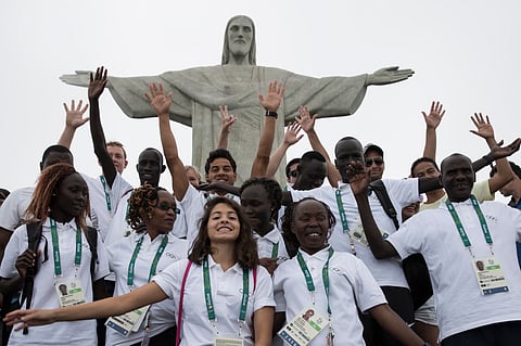 Members of the Refugee Olympic Team pose for a photo in front of the Christ the Redeemer statue in Rio de Janeiro, Brazil. (AP)