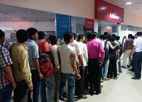 People waiting outside Reliance Digital Stores and Digital Xpress Mini Stores to get a free Jio test SIM in Ahmedabad. (IANS)