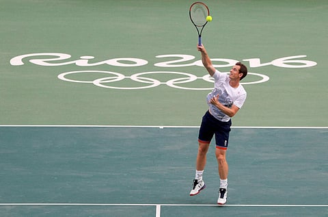 Andy Murray of Britain returns a ball during a practice session on the central court ahead of the upcoming 2016 Summer Olympics in Rio de Janeiro Brazil Tuesday Aug. 2 2016. | AP