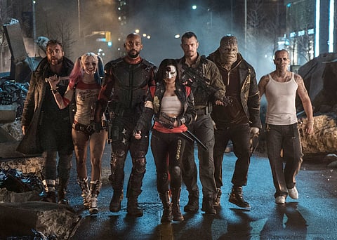 This image released by Warner Bros. Pictures shows, from left, Jai Courtney as Boomerang, Margot Robbie as Harley Quinn, Will Smith as Deadshot, Karen Fukuhara as Katana, Joel Kinnaman as Rick Flag, Adewale Akinnuoye-Agbaje as Killer Croc and Jay Hernande