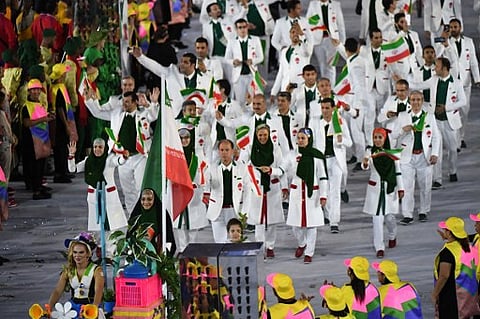 Iran's flag bearer Zahra Nemati leads her national delegation during the opening ceremony of the Rio 2016 Olympic Games at the Maracana stadium in Rio de Janeiro on August 5, 2016. | AFP