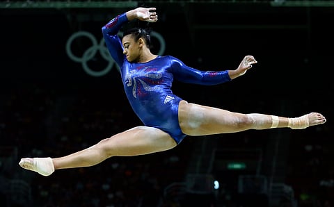 Britain's Elissa Downie performs on the balance beam during the artistic gymnastics women's qualification at the 2016 Summer Olympics in Rio de Janeiro, Brazil, Sunday, Aug. 7, 2016. | AP