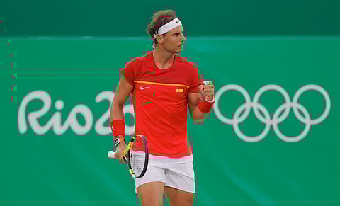 Rafael Nadal of Spain reacts after winning a point against Federico Delbonis of Argentina during the men's tennis competition at the 2016 Summer Olympics in Rio de Janeiro, Brazil, Sunday, Aug. 7, 2016. | AP
