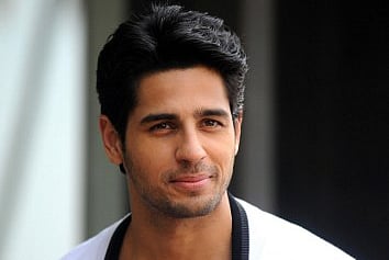 Indian Bollywood actor Sidharth Malhotra poses during a promotional event for the upcoming Hindi film 'Kapoor & Sons' | AFP