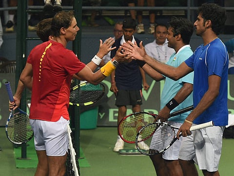 Spain's Rafael Nadal and Marc Lopez with India's Leander Paes and Saketh Myeni after win the match during the Davis Cup World Group Play off double match in New Delhi. | PTI
